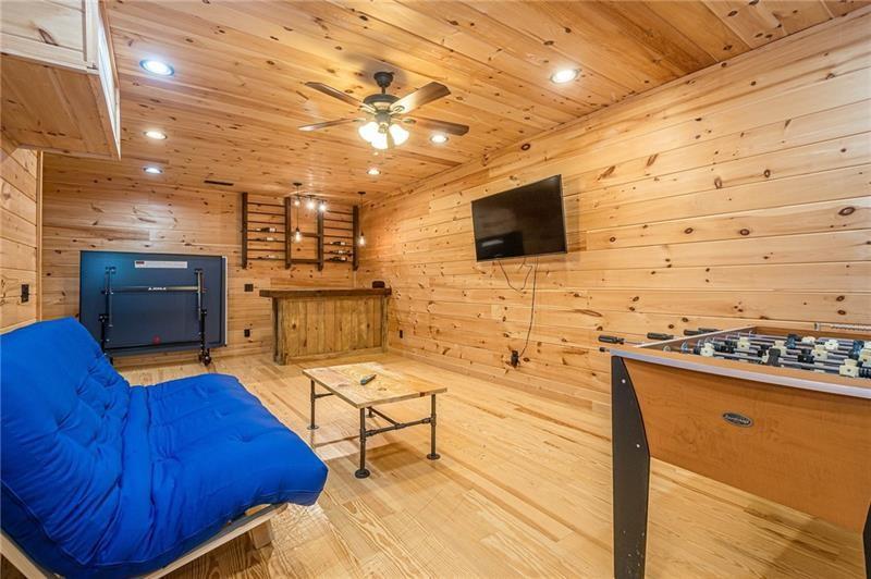 213 Moonshine Hollow Blue Ridge, GA 30513 - Photo 20 of 41 a living room with stainless steel appliances furniture a flat screen tv and kitchen view