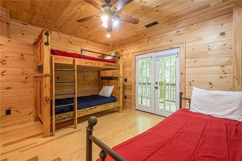 213 Moonshine Hollow Blue Ridge, GA 30513 - Photo 24 of 41 a room with furniture and a chandelier