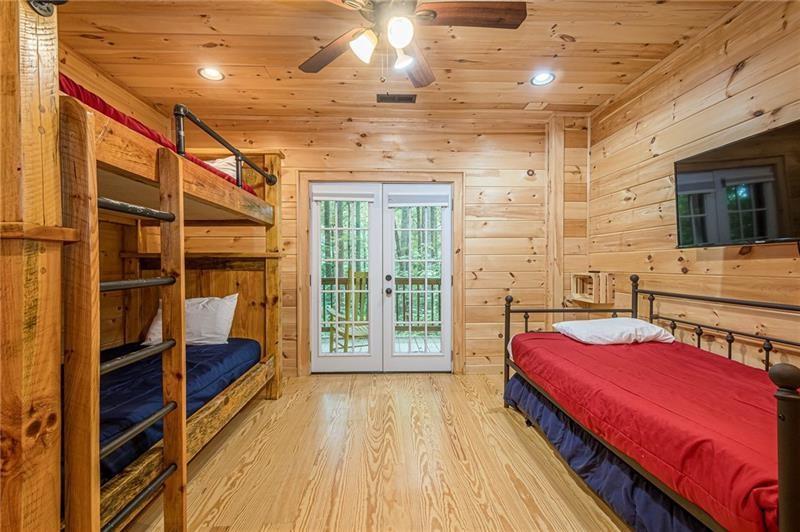 213 Moonshine Hollow Blue Ridge, GA 30513 - Photo 25 of 41 a bedroom with a bed and wooden floor
