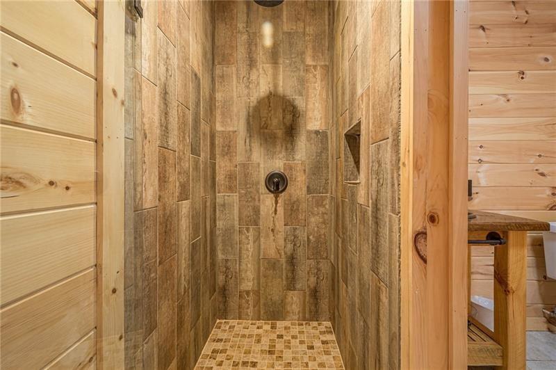 213 Moonshine Hollow Blue Ridge, GA 30513 - Photo 30 of 41 a bathroom with a shower