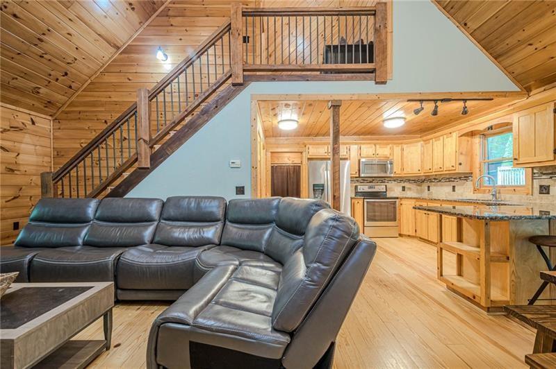 213 Moonshine Hollow Blue Ridge, GA 30513 - Photo 3 of 41 a living room with furniture and a floor to ceiling window