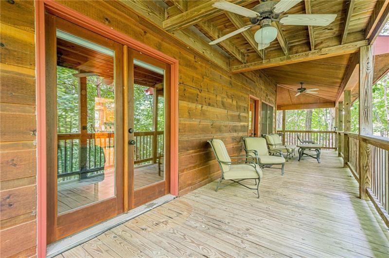 213 Moonshine Hollow Blue Ridge, GA 30513 - Photo 35 of 41 a balcony with chairs and wooden floor