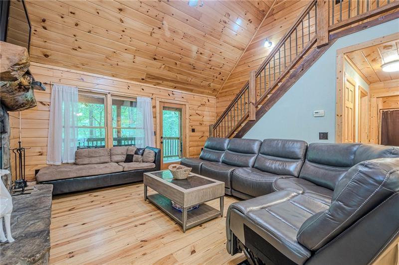 213 Moonshine Hollow Blue Ridge, GA 30513 - Photo 4 of 41 a living room with furniture and a large window