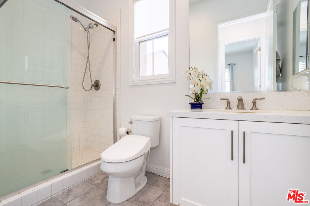 20621 West Chestnut Circle Porter Ranch, CA 91326 - Photo 15 of 30 a bathroom with a sink toilet and shower