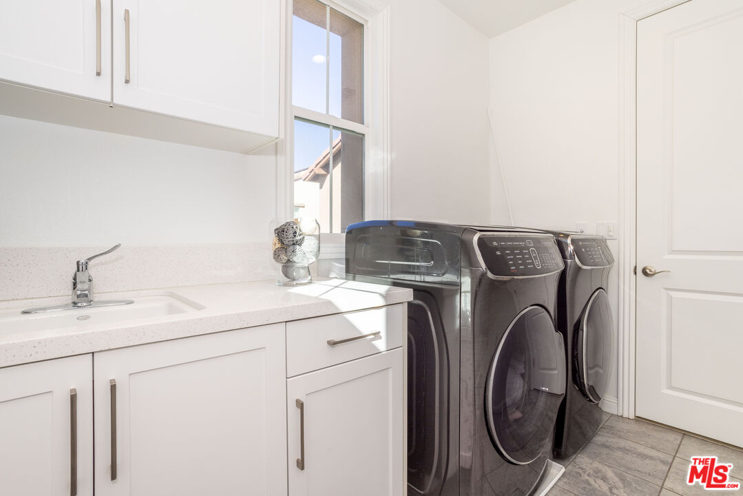 20621 West Chestnut Circle Porter Ranch, CA 91326 - Photo 22 of 30 a utility room with dryer and washer