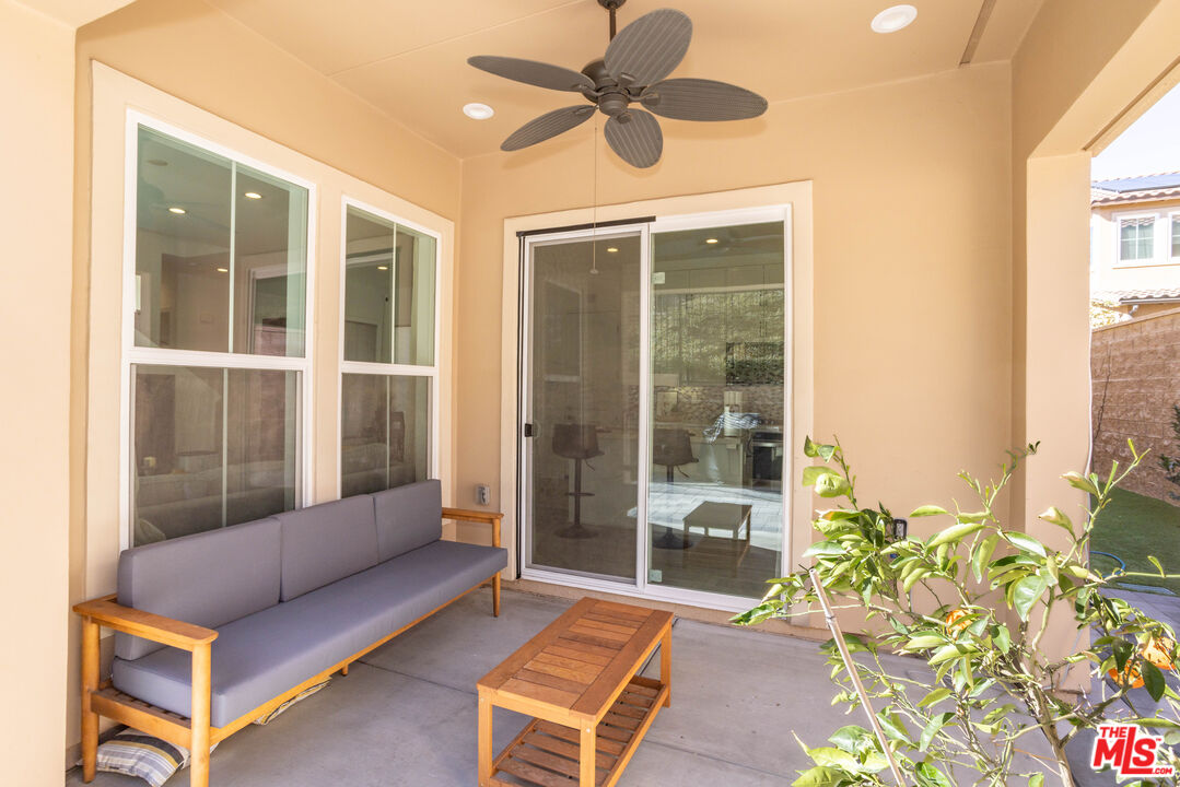 20621 West Chestnut Circle Porter Ranch, CA 91326 - Photo 24 of 30 a living room with furniture and a floor to ceiling window