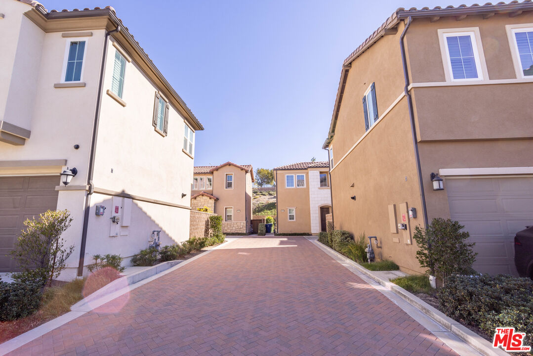 20621 West Chestnut Circle Porter Ranch, CA 91326 - Photo 29 of 30 a front view of a house with a yard