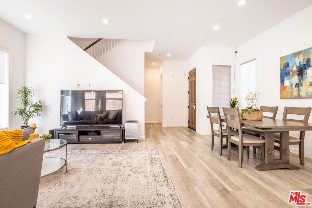 20621 West Chestnut Circle Porter Ranch, CA 91326 - Photo 3 of 30 a living room with furniture wooden floor and a flat screen tv