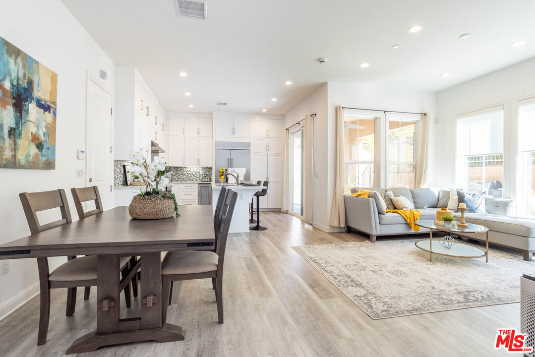 20621 West Chestnut Circle Porter Ranch, CA 91326 - Photo 7 of 30 a living room with furniture kitchen view and a large window