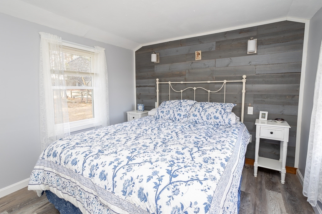 1 Ladd Avenue Wareham, MA 02571 - Photo 15 of 26 a bedroom with a bed and wooden floor