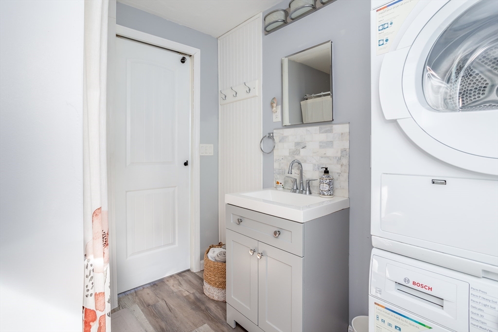 1 Ladd Avenue Wareham, MA 02571 - Photo 19 of 26 a view of a bathroom with a sink and a washer
