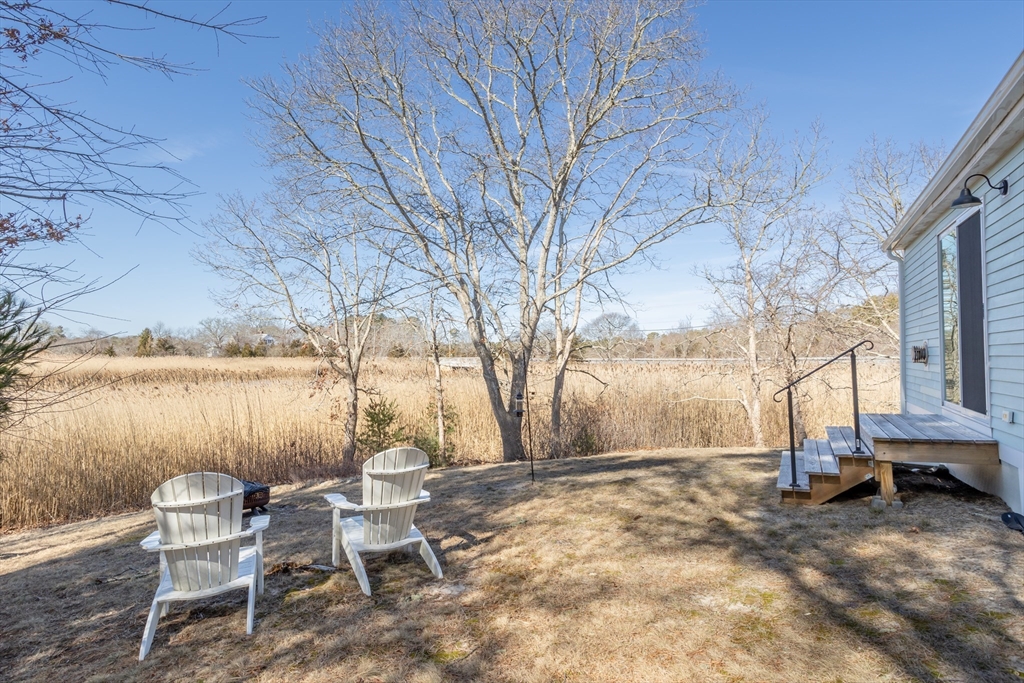1 Ladd Avenue Wareham, MA 02571 - Photo 22 of 26 a view of backyard with table and chairs and barbeque oven