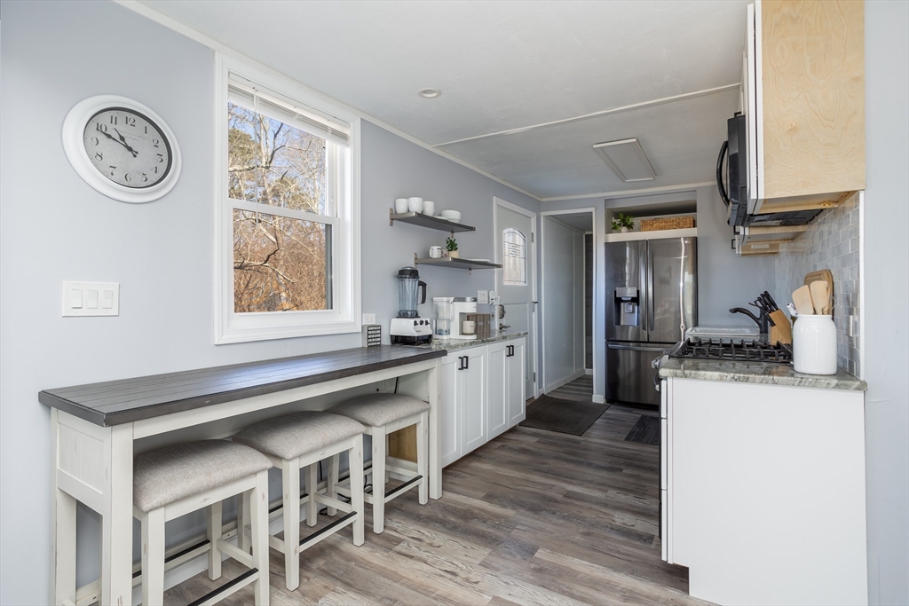 1 Ladd Avenue Wareham, MA 02571 - Photo 5 of 26 a kitchen with stainless steel appliances granite countertop a stove and a sink