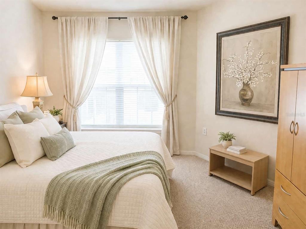 5122 Northridge Road, Unit 102 Sarasota, FL 34238 - Photo 5 of 14 a bedroom with a bed and a window