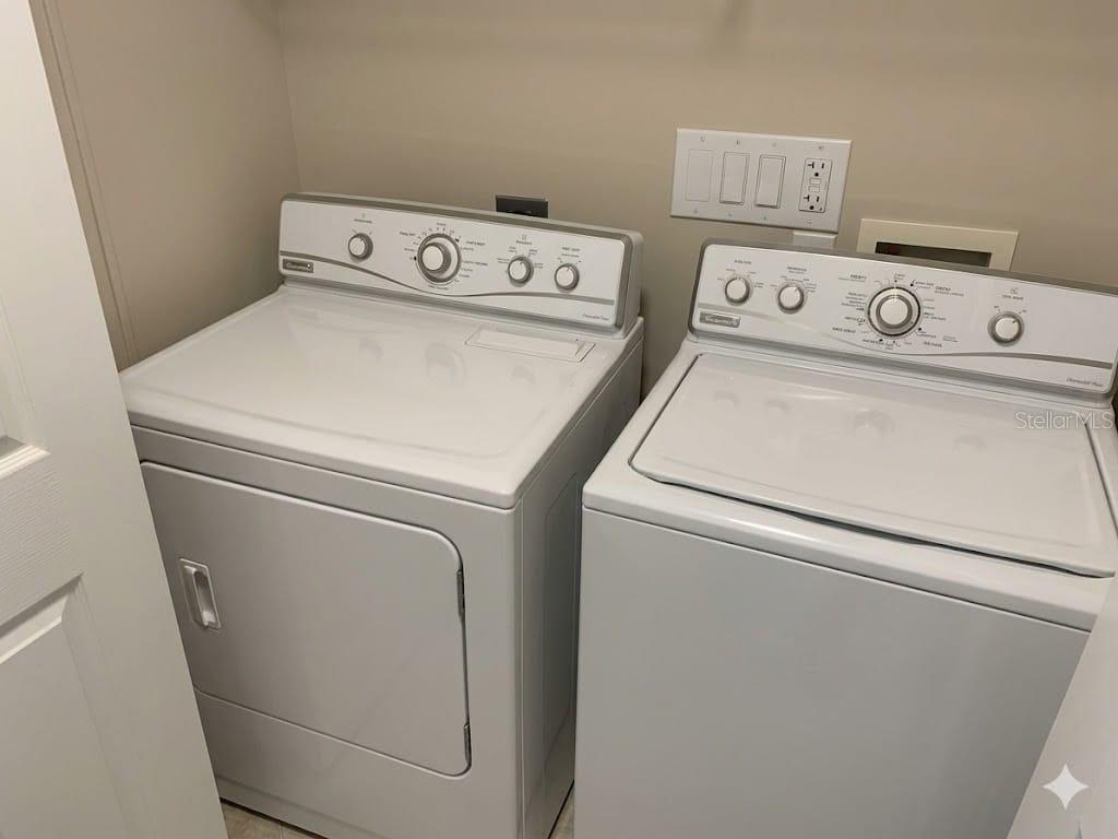 5122 Northridge Road, Unit 102 Sarasota, FL 34238 - Photo 9 of 14 a utility room with dryer and washer