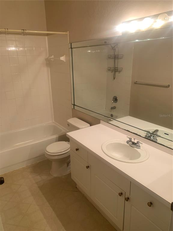 5122 Northridge Road, Unit 102 Sarasota, FL 34238 - Photo 10 of 12 a bathroom with a sink a toilet and shower