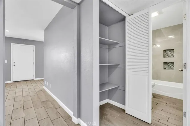 a bathroom with a bathtub a shower and a shower