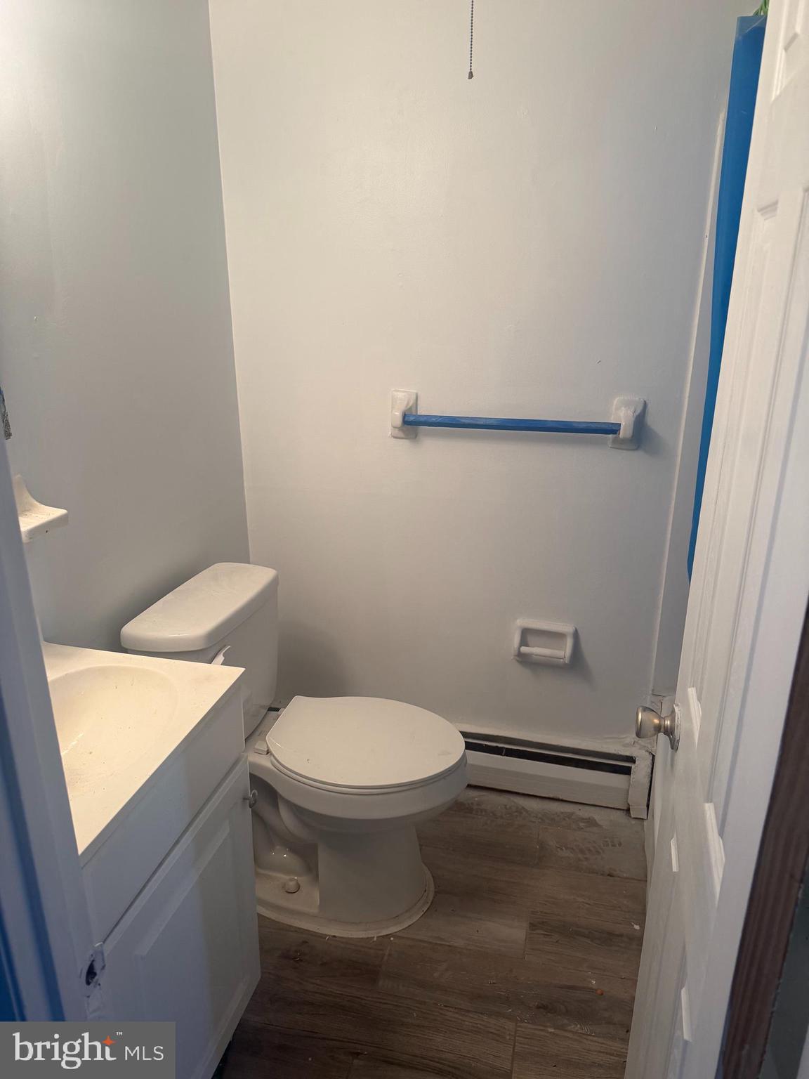 2638 Parkside Terrace Brookhaven, PA 19015 - Photo 7 of 9 a white toilet sitting next to a sink