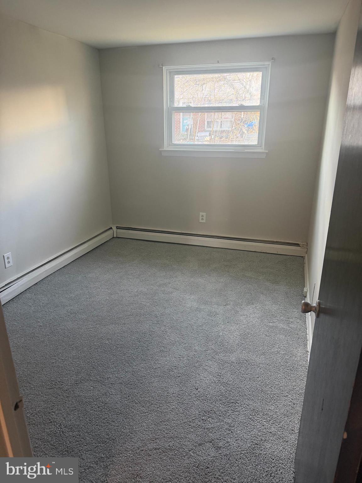 2638 Parkside Terrace Brookhaven, PA 19015 - Photo 8 of 9 an empty room with a window