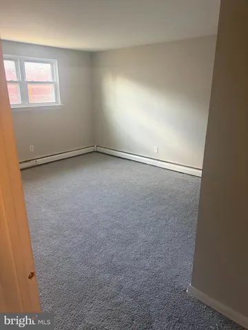 an empty room with a empty space and window