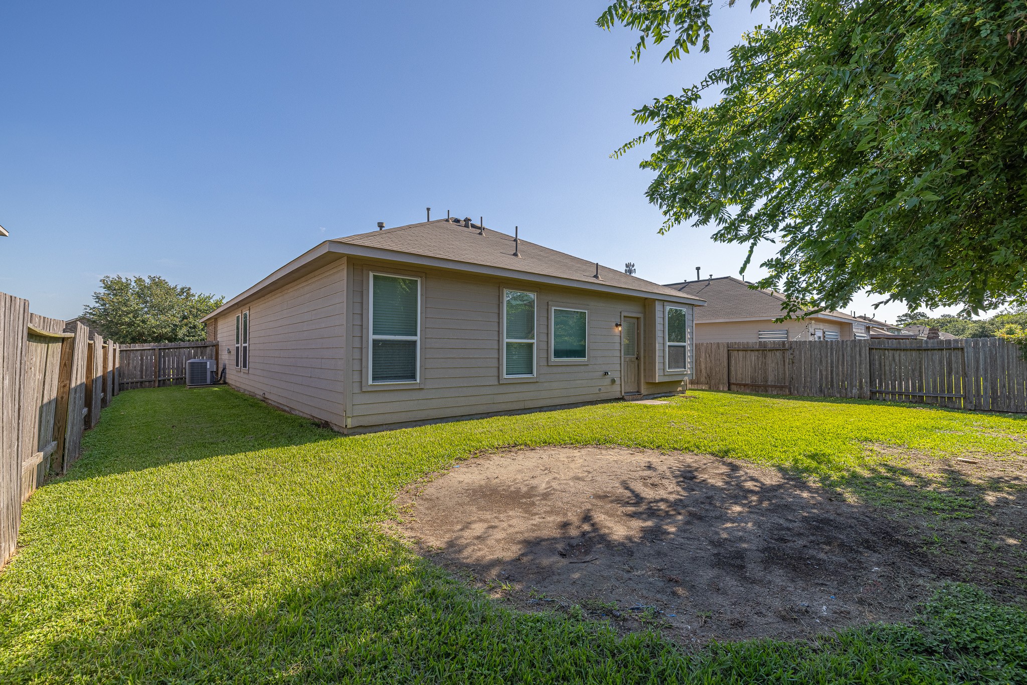 3818 Hunters Trail Baytown, TX 77521 - Photo 30 of 32 a view of backyard of house with green space