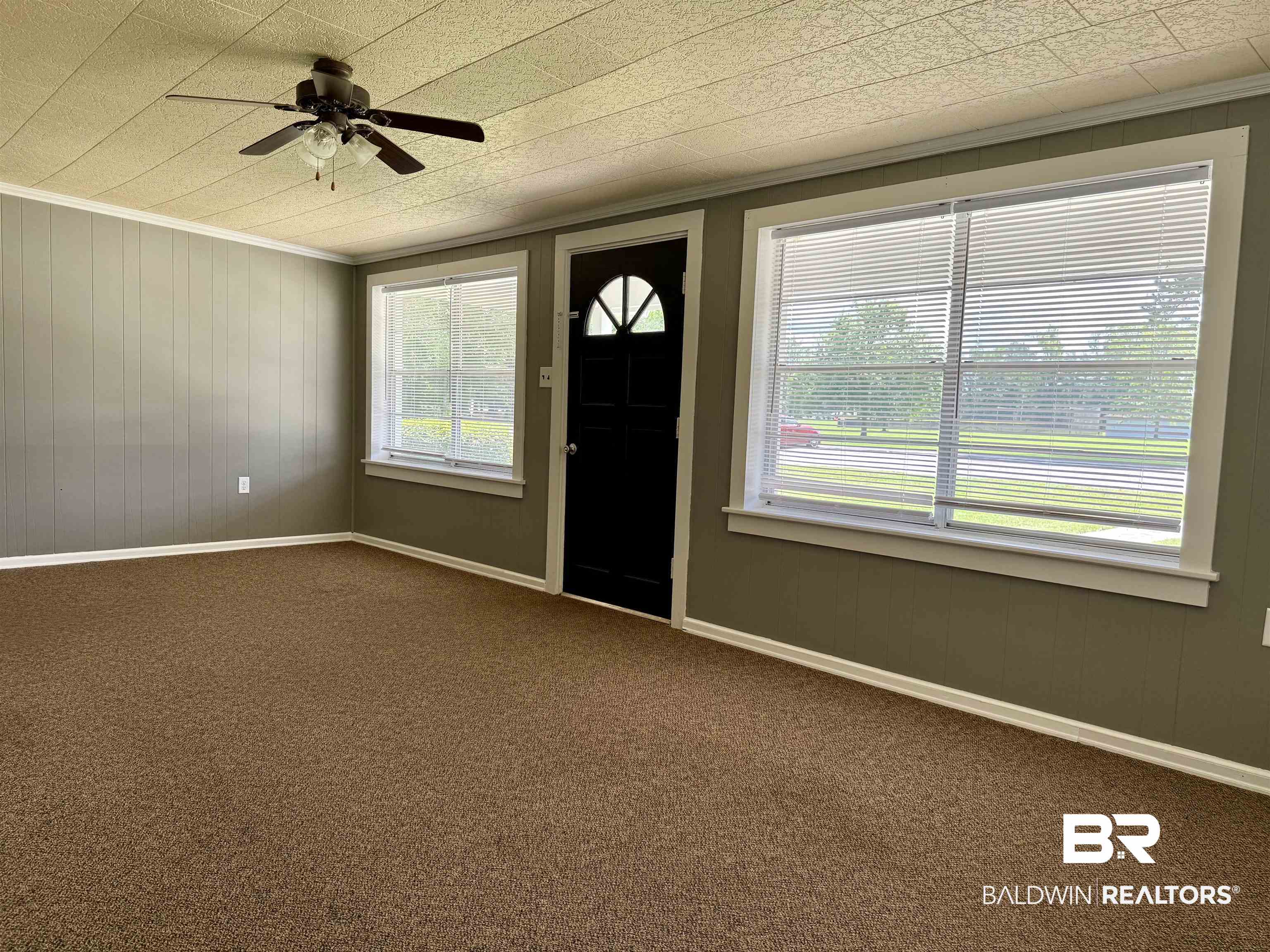 103 Kimberly Street Brewton, AL 36426 - Photo 5 of 18 Foyer with carpet flooring, a ceiling fan, and ornamental molding