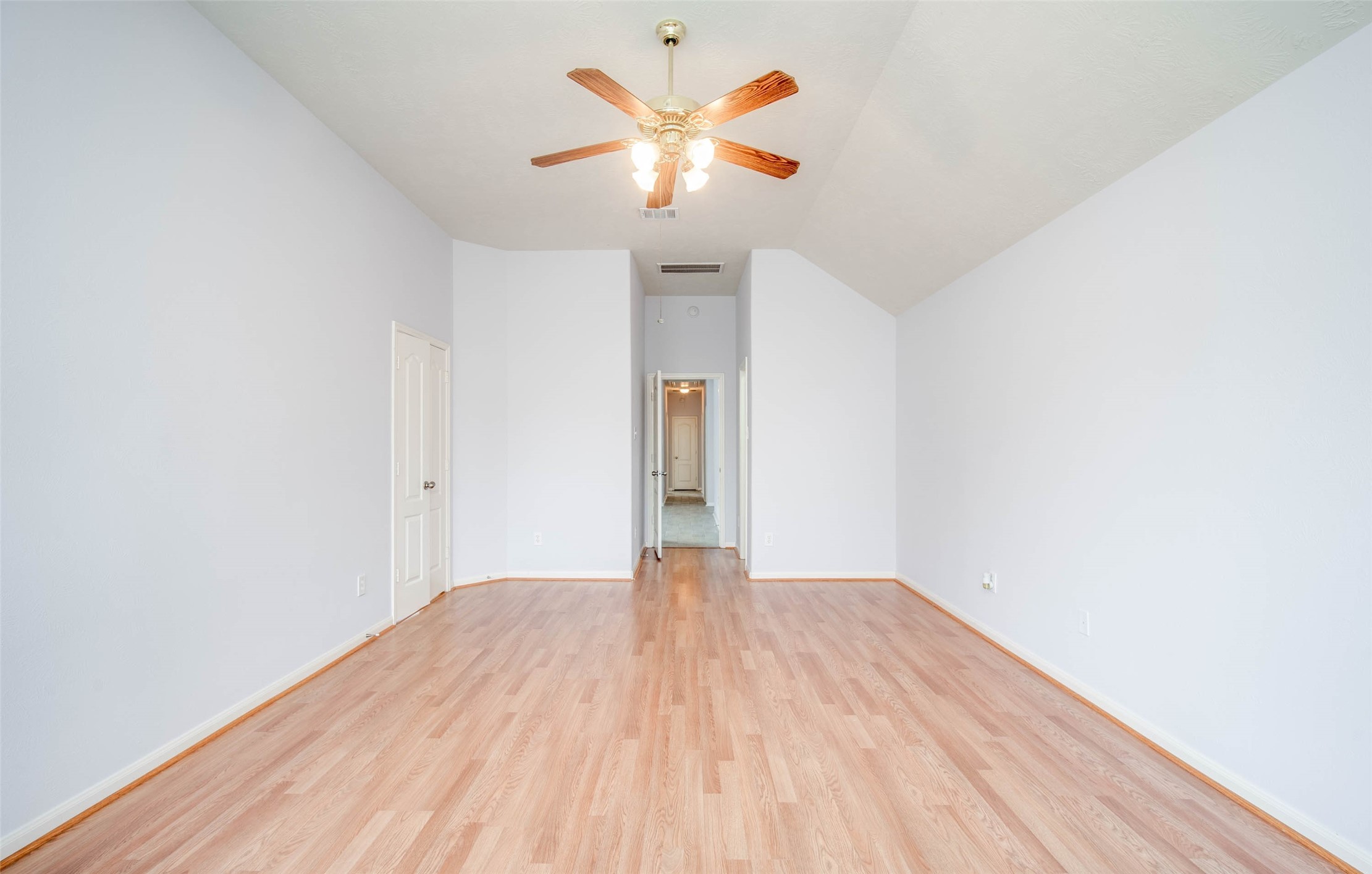 9323 Hillhaven Court Rosenberg, TX 77469 - Photo 23 of 37 a view of an empty room with window and wooden floor