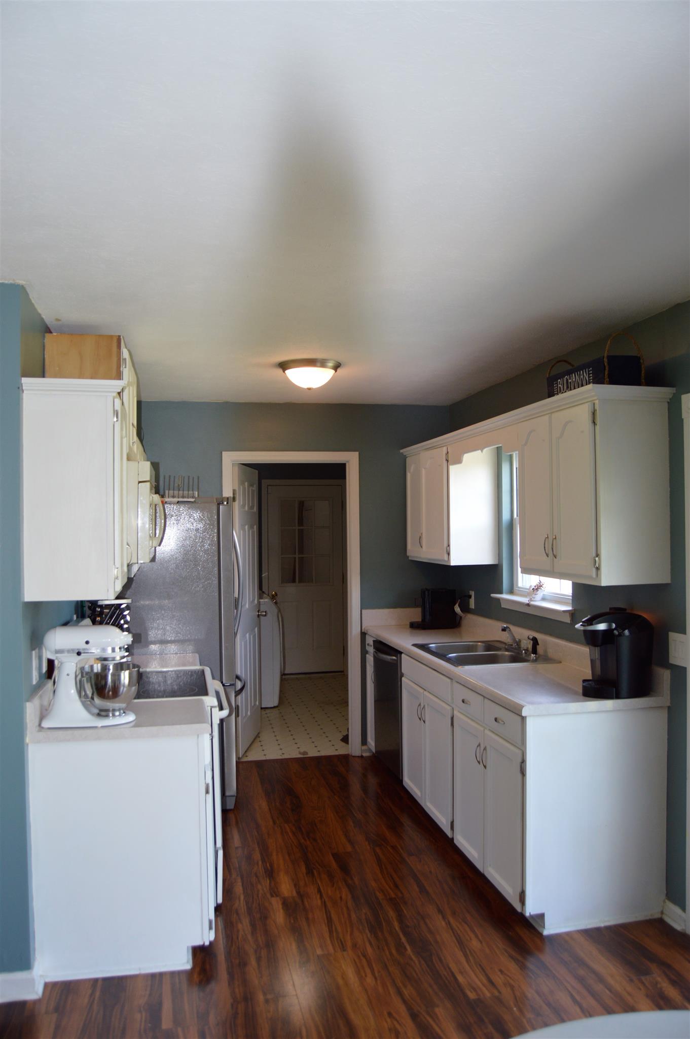 1529 Longview Road Unionville, TN 37180 - Photo 3 of 21 a kitchen with a sink stove and cabinets