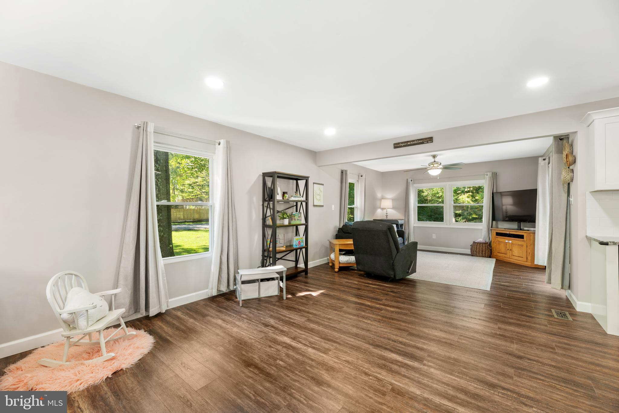 5756 Stephen Reid Road Huntingtown, MD 20639 - Photo 32 of 42 a living room with furniture window and wooden floor