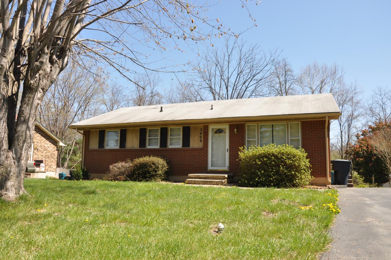 2409 Meadowbrook Road Northwest Roanoke, VA 24017 - Photo 1 of 2 a front view of a house with garden