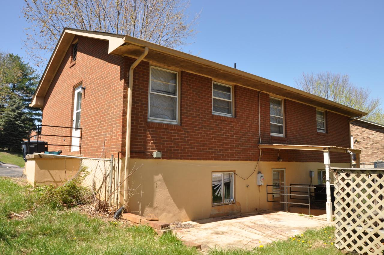 2409 Meadowbrook Road Northwest Roanoke, VA 24017 - Photo 2 of 2 a front view of a house with a yard