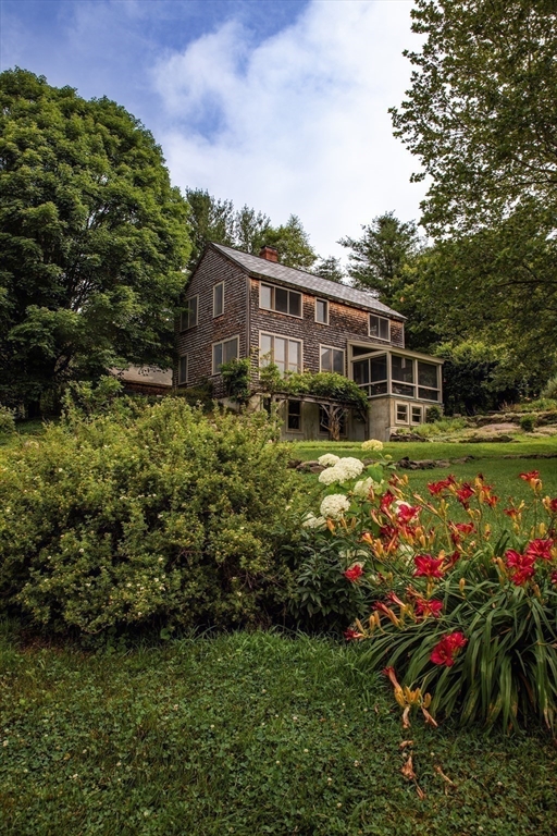 45 Sessions Road Hardwick, MA 01037 - Photo 4 of 28 a view of a house with a big yard and potted plants
