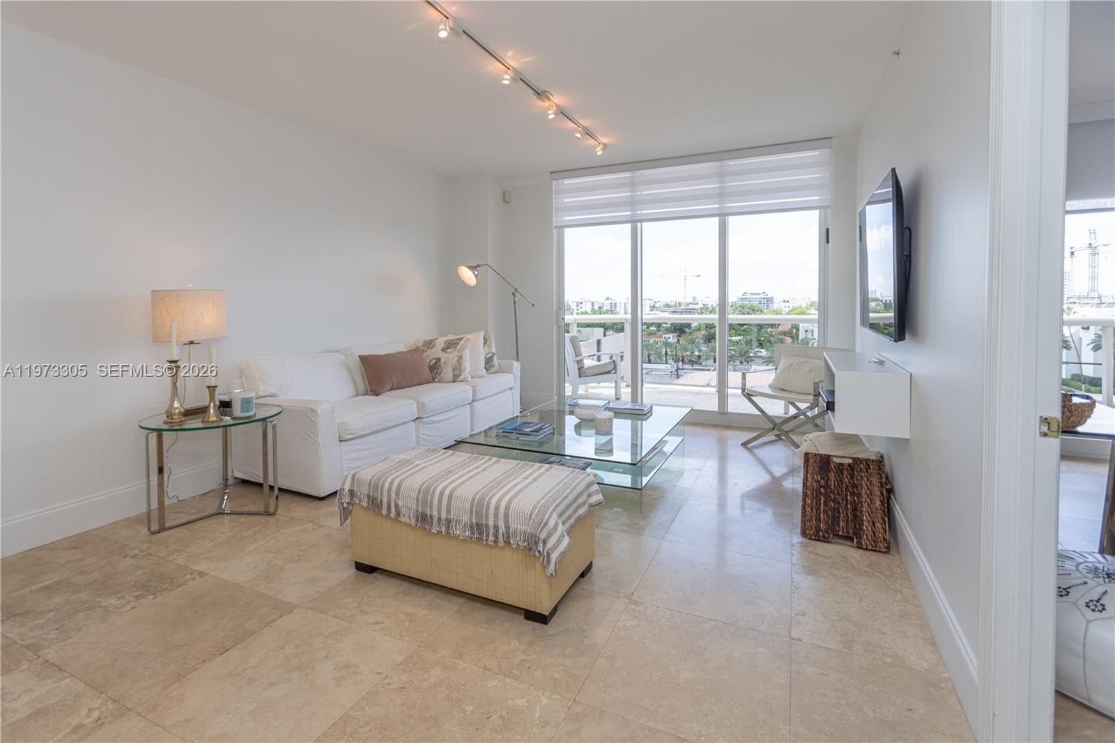 9595 Collins Avenue, Unit N6F Surfside, FL 33154 - Photo 11 of 26 a spacious bedroom with a bed and large window