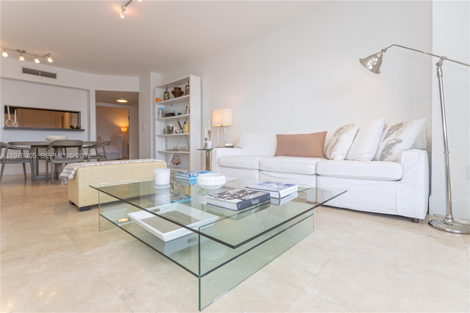 9595 Collins Avenue, Unit N6F Surfside, FL 33154 - Photo 16 of 26 a living room with furniture and a table