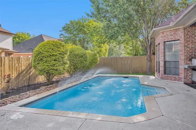 a view of backyard with green space