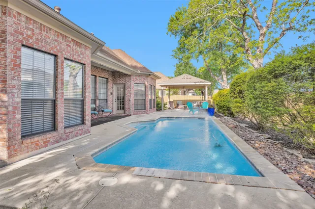 a view of a house with swimming pool