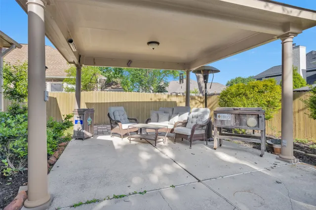 a living room filled with furniture and a large window