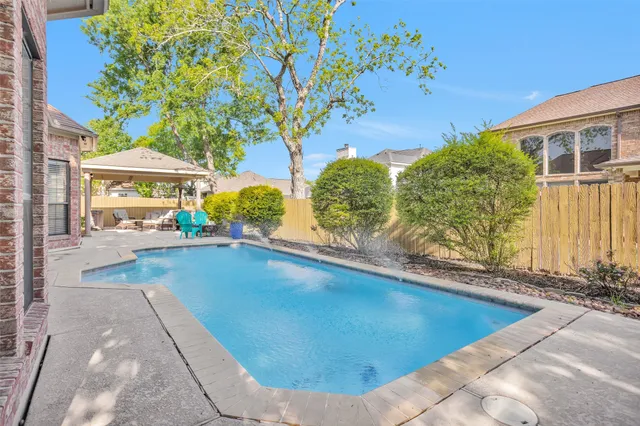 a view of a swimming pool with an outdoor space