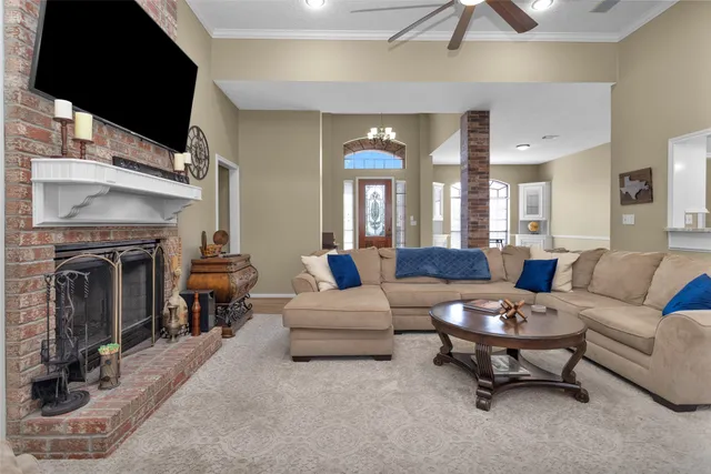 a living room with furniture and a fireplace