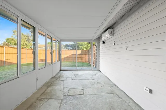 a view of an empty room and window