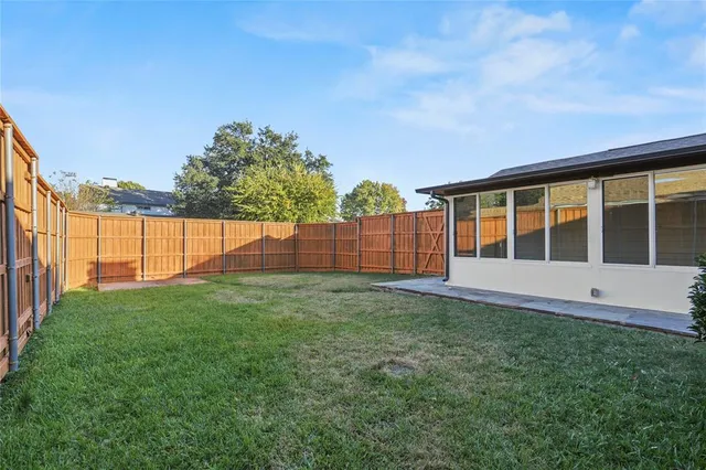 a view of backyard with green space