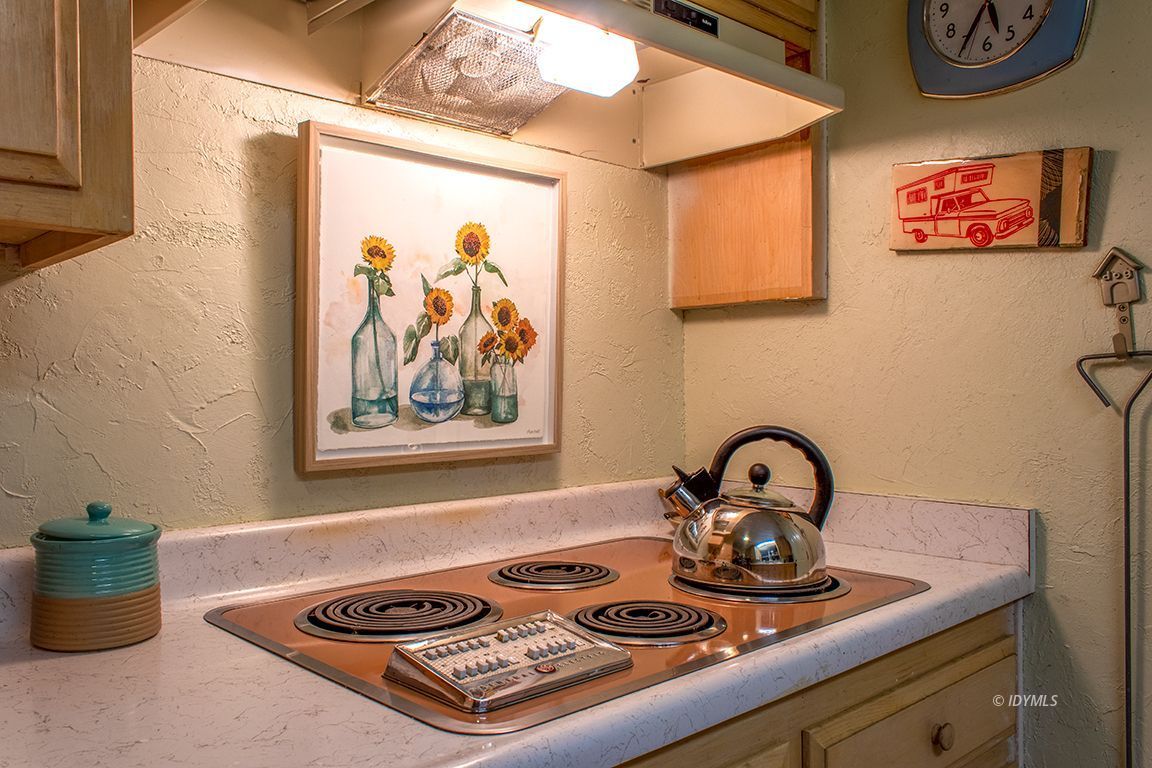 24730 High Grove Road Idyllwild, CA 92549 - Photo 11 of 24 a picture of a table and a microwave