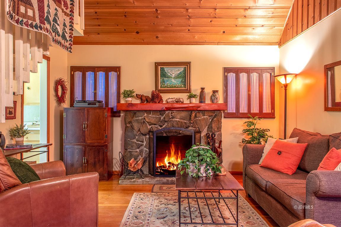 24730 High Grove Road Idyllwild, CA 92549 - Photo 3 of 24 a living room with furniture and a fireplace