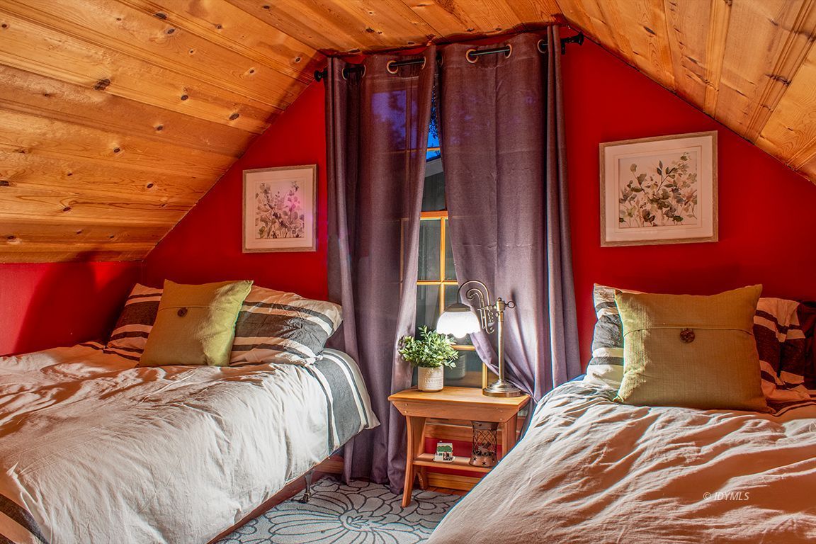 24730 High Grove Road Idyllwild, CA 92549 - Photo 21 of 24 a bed sitting in a bedroom next to a window