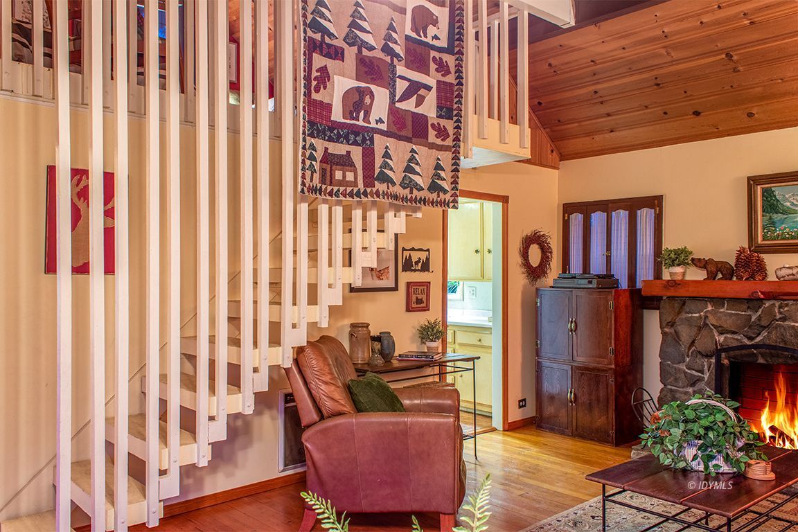 24730 High Grove Road Idyllwild, CA 92549 - Photo 8 of 24 a living room with furniture and a fireplace
