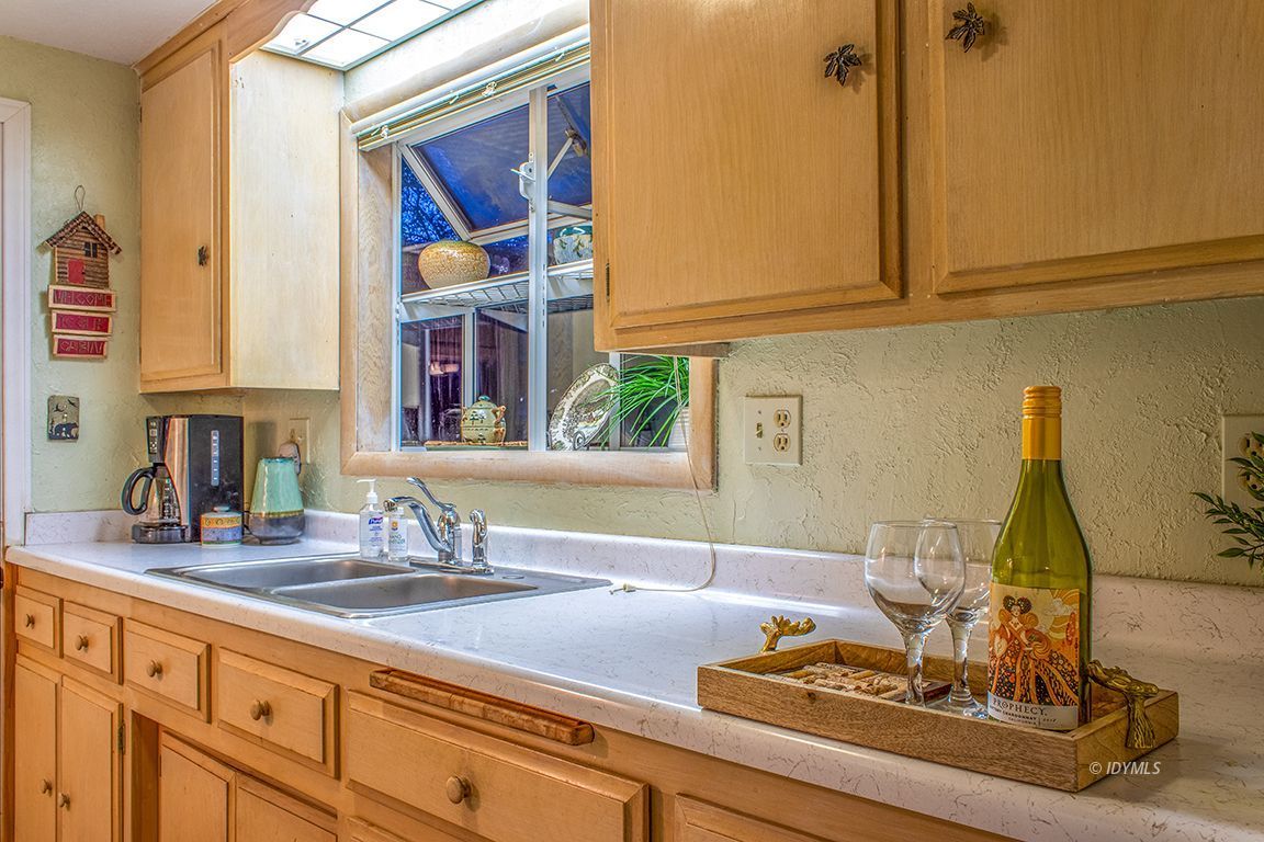 24730 High Grove Road Idyllwild, CA 92549 - Photo 10 of 24 a kitchen with a sink and cabinets