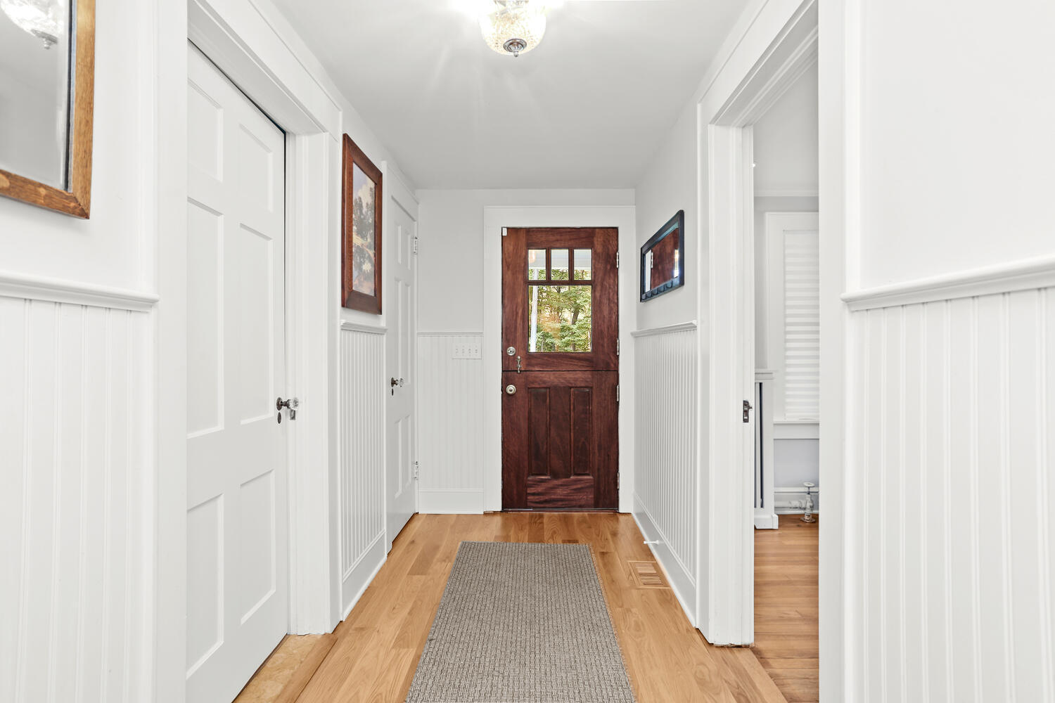 Undisclosed Address Norwalk, CT 06850 - Photo 17 of 40 a view of a hallway with wooden floor and windows