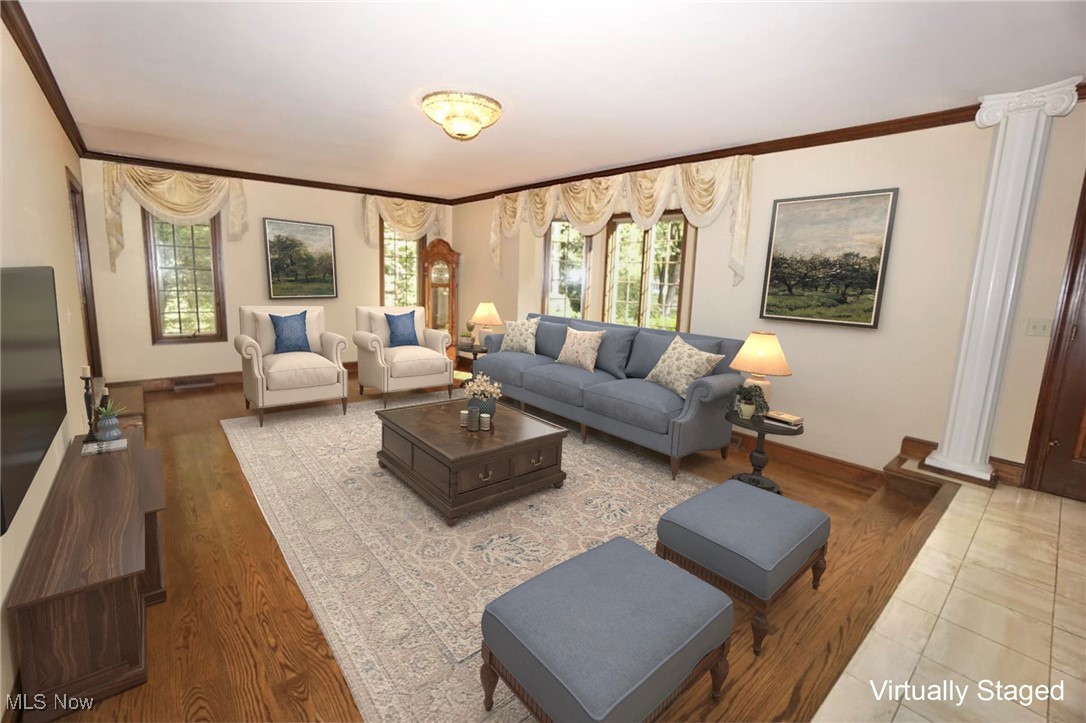 1760 Chartley Road Gates Mills, OH 44040 - Photo 6 of 49 Living room featuring ornate columns, crown molding, and wood finished floors