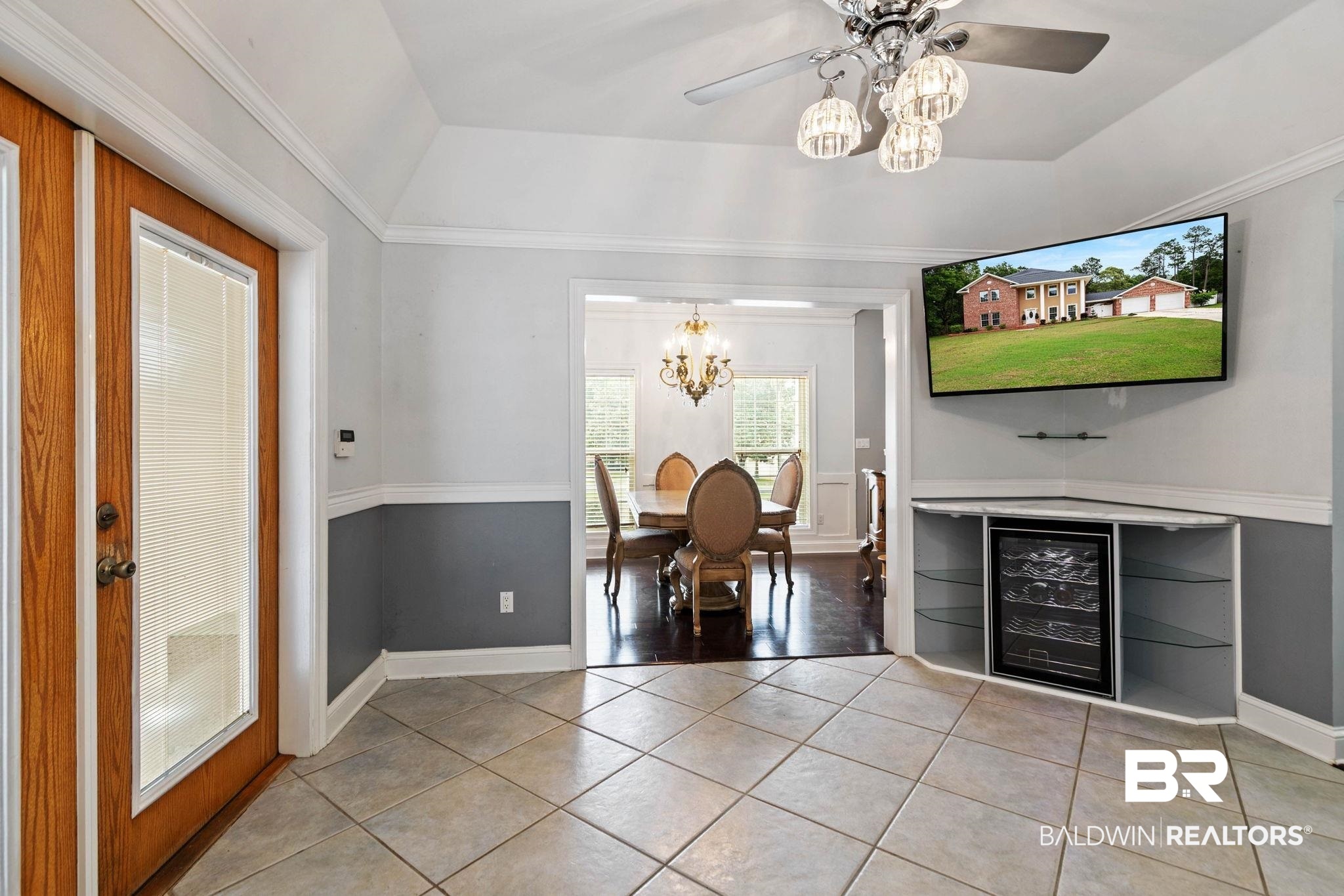 2 Speckle Trout Route Daphne, AL 36527 - Photo 14 of 61 Dining space featuring beverage cooler, light tile patterned floors, suspended lighting, a tray ceiling, and a ceiling fan