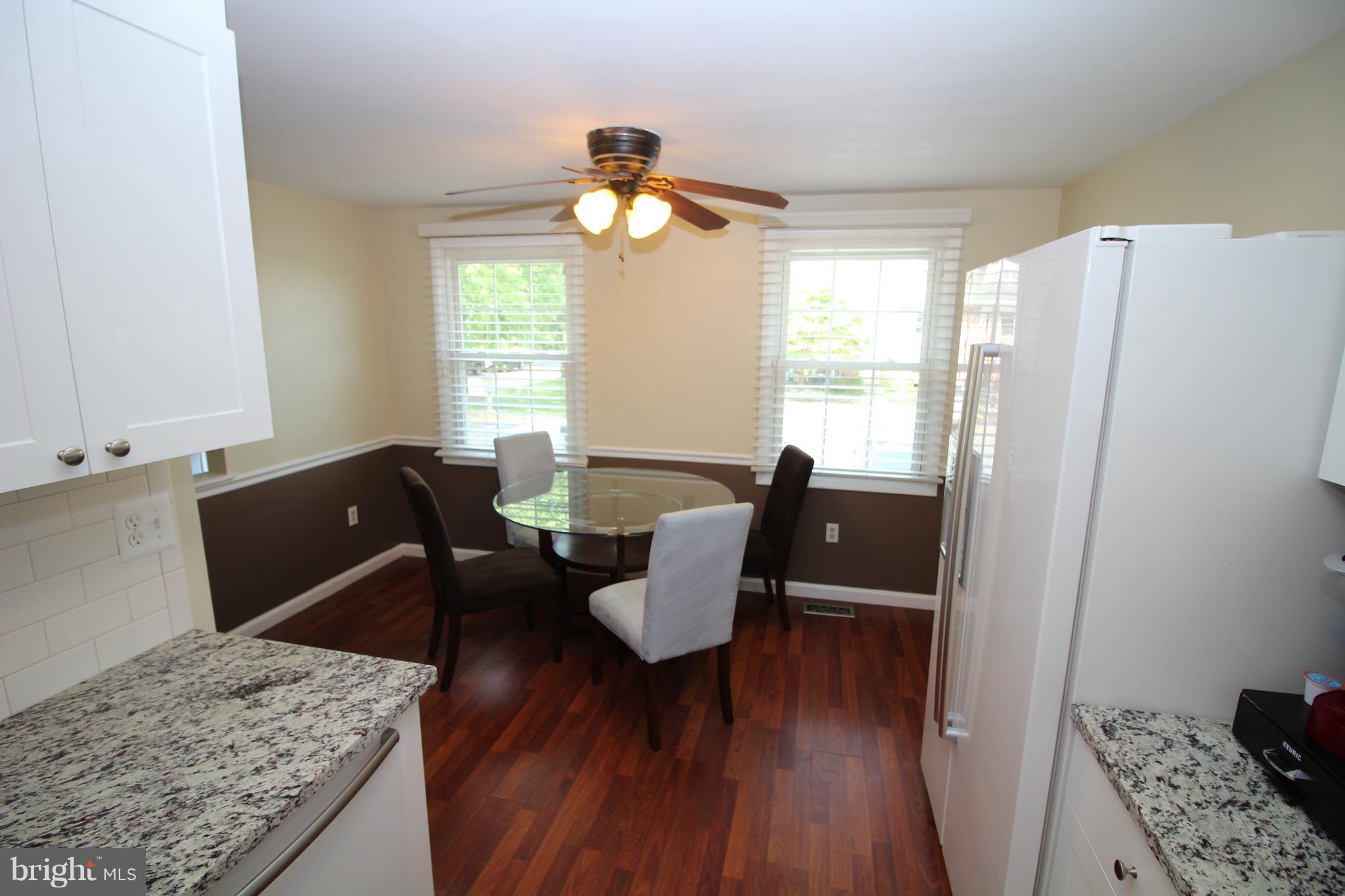 17667 Kohlhoss Road Poolesville, MD 20837 - Photo 3 of 27 a living room with furniture and wooden floor